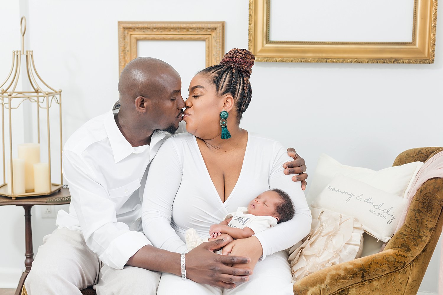a family in Philadelphia celebrates the birth of their son in a studio portrait session