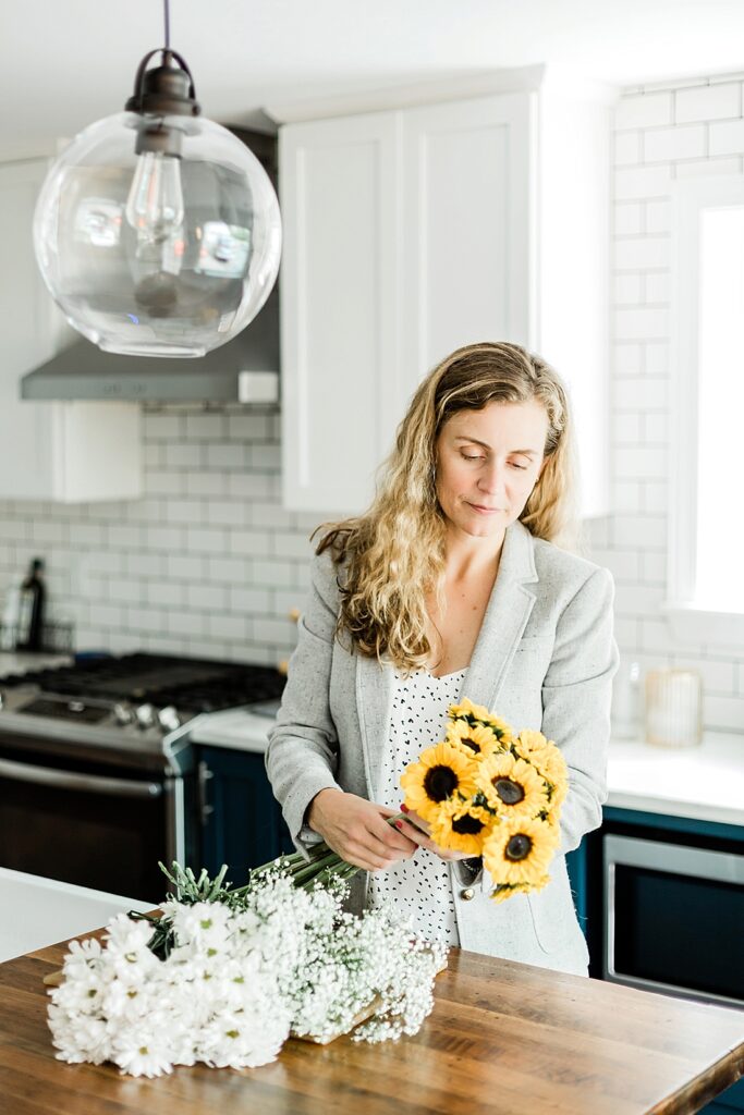 Realtor gets home ready for showings with fresh flowers